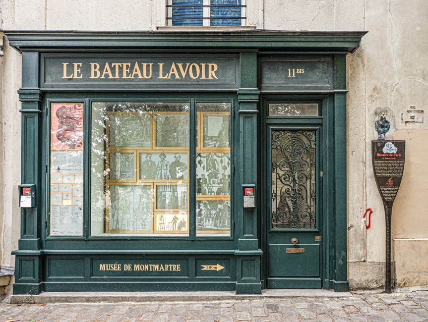 Historic façade of Le Bateau Lavoir in Montmartre, Paris, known for its artistic history.